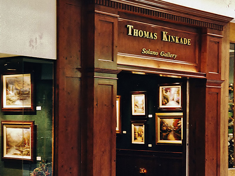 Stained knotty pine store front for Kinkade art gallery
Heavy panel columns and built up architectural crown details  