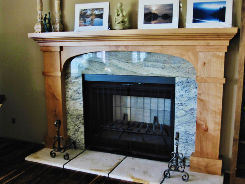 Mission style mantel with elliptical 
Arch rail , hard edge details,  
Knotty alder, clear lacquer finish