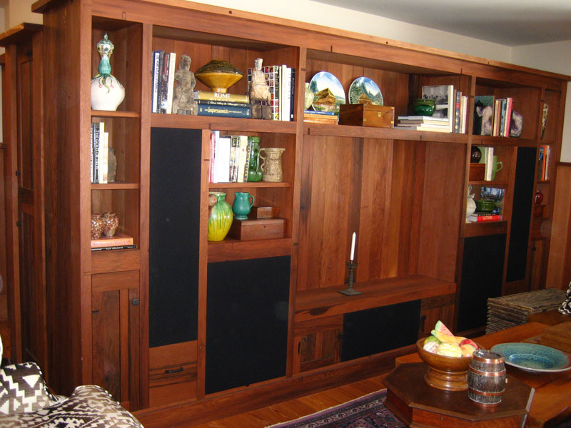 Reclaimed wine vat red wood   entertainment wall unit 
with speaker grills ,  paneled end 