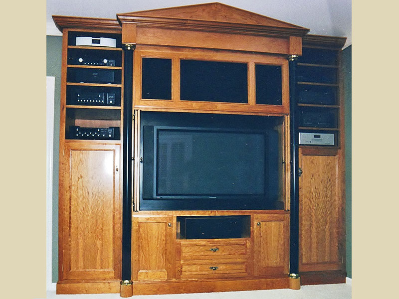 cherry wood wall unit with columns and pediment